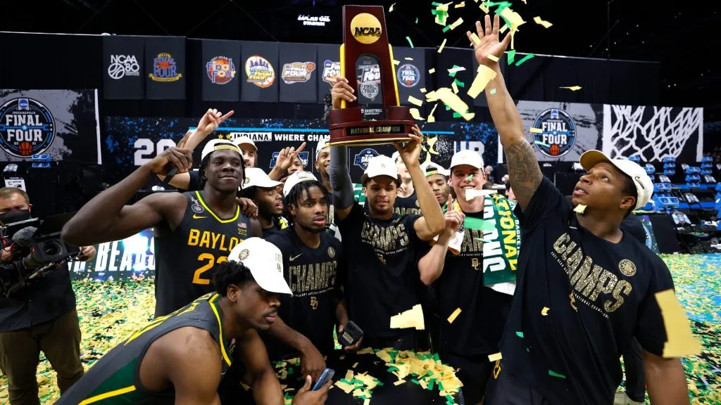 MaCio Teague #31 of the Baylor Bears holds up the trophy after defeating the Gonzaga Bulldogs 86-70 in the National Championship game of the 2021 NCAA Men’s Basketball Tournament. (Source: Jamie Squire/Getty Images)