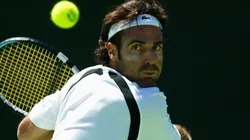 Alex Corretja of Spain hits a backhand against Hicham Arazi of Morocco during the Commonwealth Bank International played at the Kooyong Lawn Tennis Club.