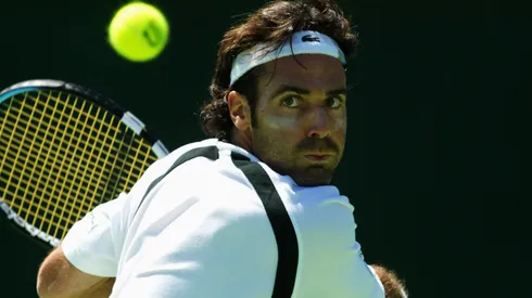 Alex Corretja of Spain hits a backhand against Hicham Arazi of Morocco during the Commonwealth Bank International played at the Kooyong Lawn Tennis Club.