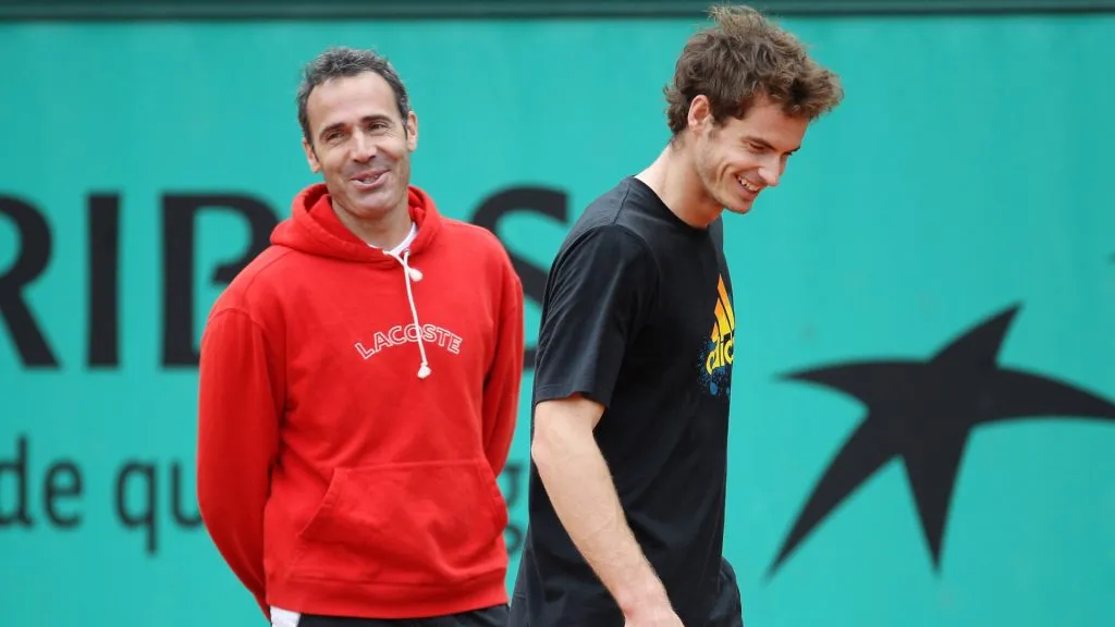 Andy Murray of Great Britain shares a joke with his coach Alex Corretja during a practice session on day seven of the French Open at Roland Garros. (Julian Finney/Getty Images)
