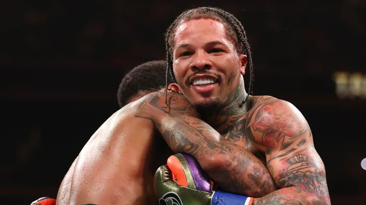 Gervonta Davis smiles in a clinch with Lamont Roach Jr. during their bout for Davis' WBA lightweight title at Barclays Center on March 01, 2025 in New York City.