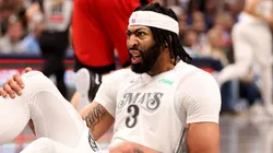 Anthony Davis of the Dallas Mavericks reacts after an injury.