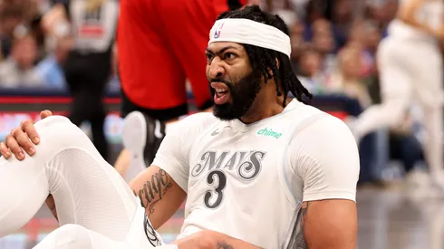 Anthony Davis of the Dallas Mavericks reacts after an injury.