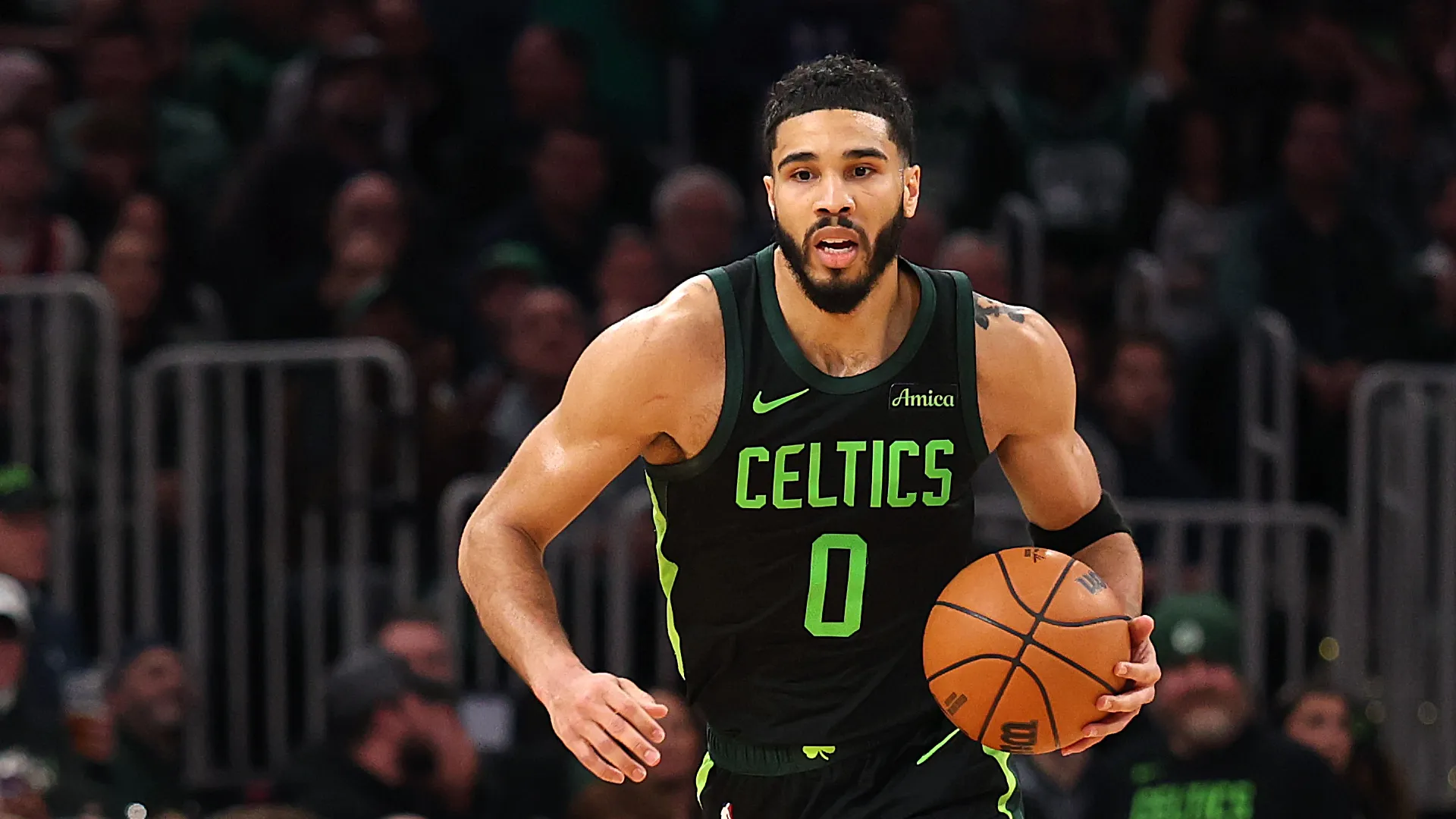Jayson Tatum #0 of the Boston Celtics dribbles downcourt against the Cleveland Cavaliers