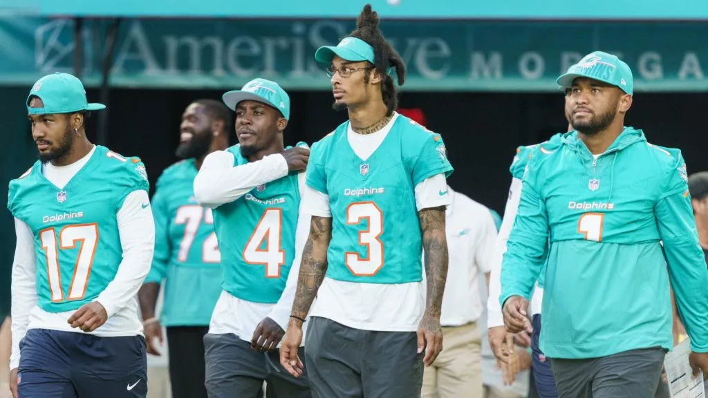 From left, wide receiver Jaylen Waddle #17, cornerback Kader Kohou #4, wide receiver Robbie Chosen #3, and quarterback Tua Tagovailoa #1 of the Miami Dolphins walk onto the field before a preseason game against the Atlanta Falcons at Hard Rock Stadium on August 11, 2023 in Miami Gardens, Florida.