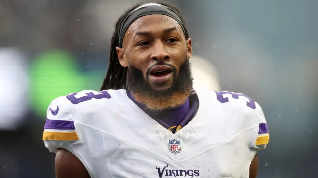 Aaron Jones looks on before a game