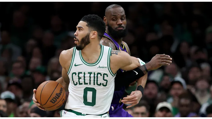Los Angeles Lakers' LeBron James defends Boston Celtics' Jayson Tatum.