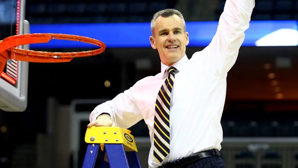 Head coach Billy Donovan of the Florida Gators cuts the net after defeating the Dayton Flyers 62-52 in the south regional final of the 2014 NCAA Men’s Basketball Tournament. (Source: Streeter Lecka/Getty Images)