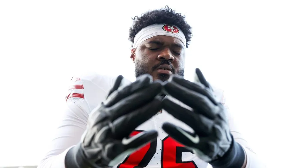 Jaylon Moore #76 of the San Francisco 49ers pauses for a moment before the game against the Seattle Seahawks at Lumen Field on October 10, 2024 in Seattle, Washington.