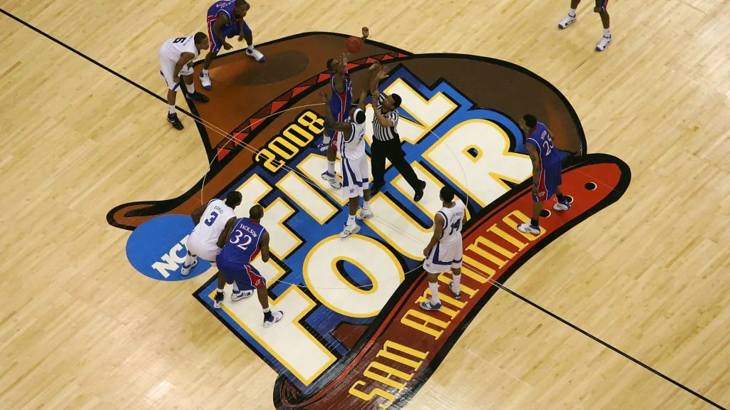 Robert Dozier #2 of the Memphis Tigers and Darrell Arthur #00 of the Kansas Jayhawks both jump for the tip-off to start the first half during the 2008 NCAA Men’s National Championship game. (Source: Ronald Martinez/Getty Images)