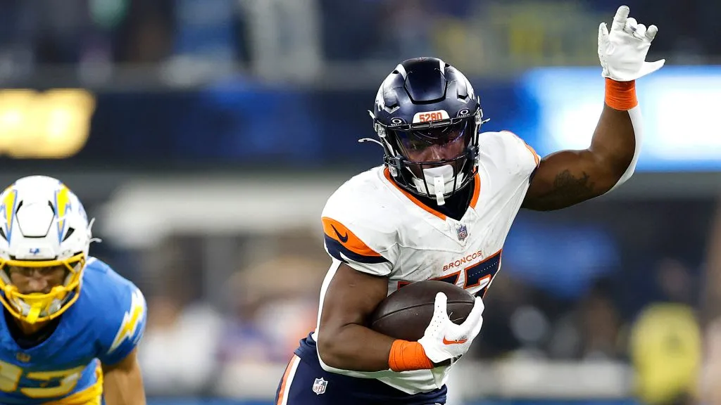 Javonte Williams #33 of the Denver Broncos runs the ball against the Los Angeles Chargers
