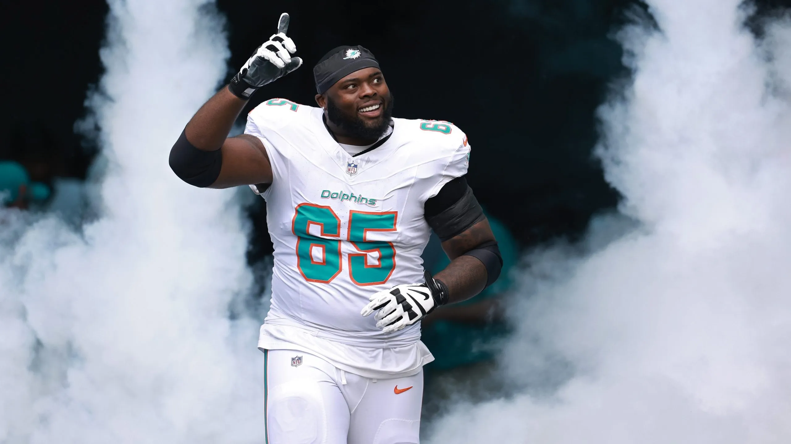 MIAMI GARDENS, FLORIDA – OCTOBER 27: Robert Jones #65 of the Miami Dolphins takes the field before playing the Arizona Cardinals at Hard Rock Stadium on October 27, 2024 in Miami Gardens, Florida. (Photo by Carmen Mandato/Getty Images)