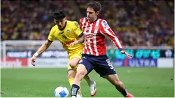Mateo Chavez of Chivas fights for the ball with Kevin Alvarez of America