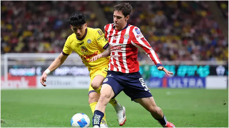 Mateo Chavez of Chivas fights for the ball with Kevin Alvarez of America