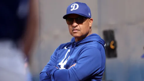 Manager Dave Roberts #30 of the Los Angeles Dodgers watches the action during workouts at Camelback Ranch on February 11, 2025 in Glendale, Arizona.