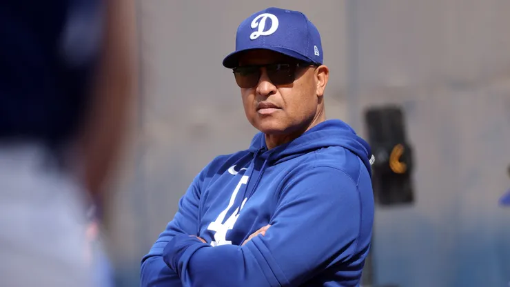 Manager Dave Roberts #30 of the Los Angeles Dodgers watches the action during workouts at Camelback Ranch on February 11, 2025 in Glendale, Arizona.