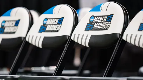 A close up of the March Madness logo on the team bench chairs in the first round between the Pittsburgh Panthers and the Iowa State Cyclones of the NCAA Men's Basketball Tournament in 2023.