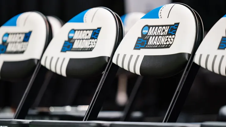 A close up of the March Madness logo on the team bench chairs in the first round between the Pittsburgh Panthers and the Iowa State Cyclones of the NCAA Men's Basketball Tournament in 2023.