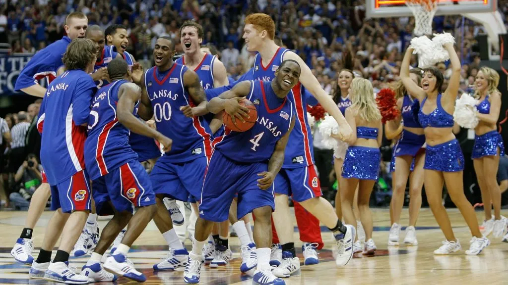 Sherron Collins #4 and the Kansas Jayhawks celebrate after defeating the Memphis Tigers 75-68 in overtime during the 2008 NCAA Men’s National Championship game. (Source: Streeter Lecka/Getty Images)