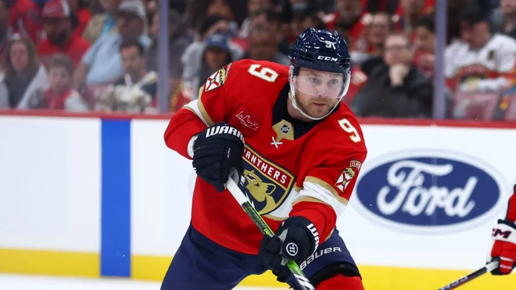 Sam Bennett #9 of the Florida Panthers passes the puck against the Washington Capitals during the third period of the game at Amerant Bank Arena on November 25, 2024 in Sunrise, Florida.