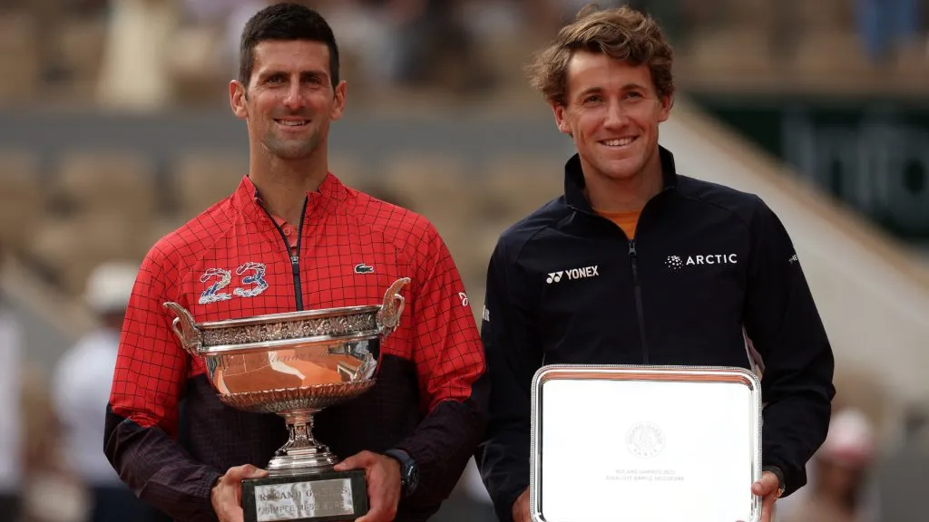 Winner Novak Djokovic and Runner up Casper Ruud pose with their trophies after the Men’s Singles Final match of the 2023 French Open at Roland Garros. (Julian Finney/Getty Images)