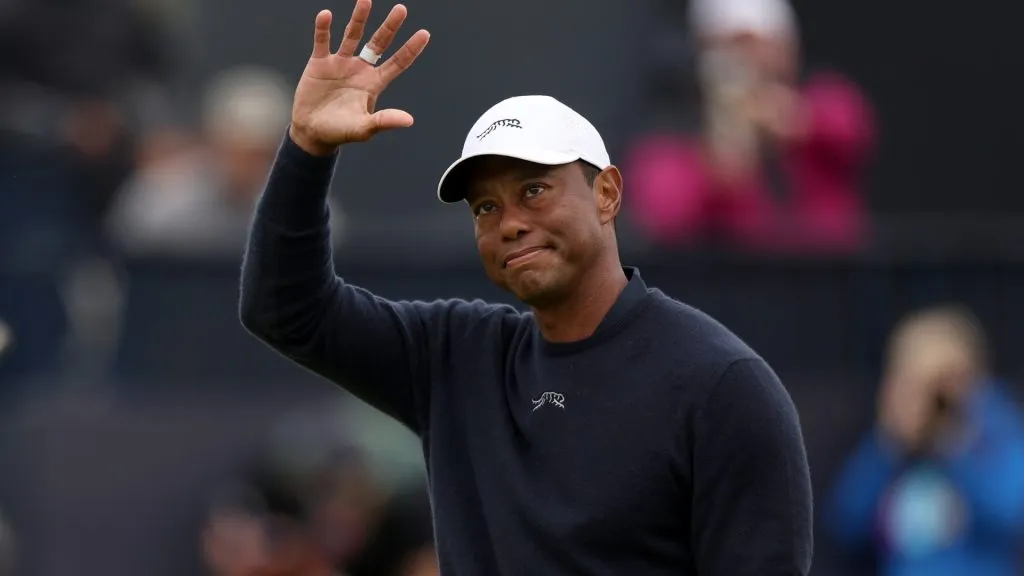 Tiger Woods acknowledges the crowd as he walks off the 18th green after finishing his round during day two of The 152nd Open championship at Royal Troon on July 19, 2024. (Source: Harry How/Getty Images)