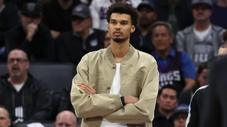 Injured Victor Wembanyama #1 of the San Antonio Spurs watches his team play against the Sacramento Kings during the second half at Golden 1 Center on March 07, 2025 in Sacramento, California.
