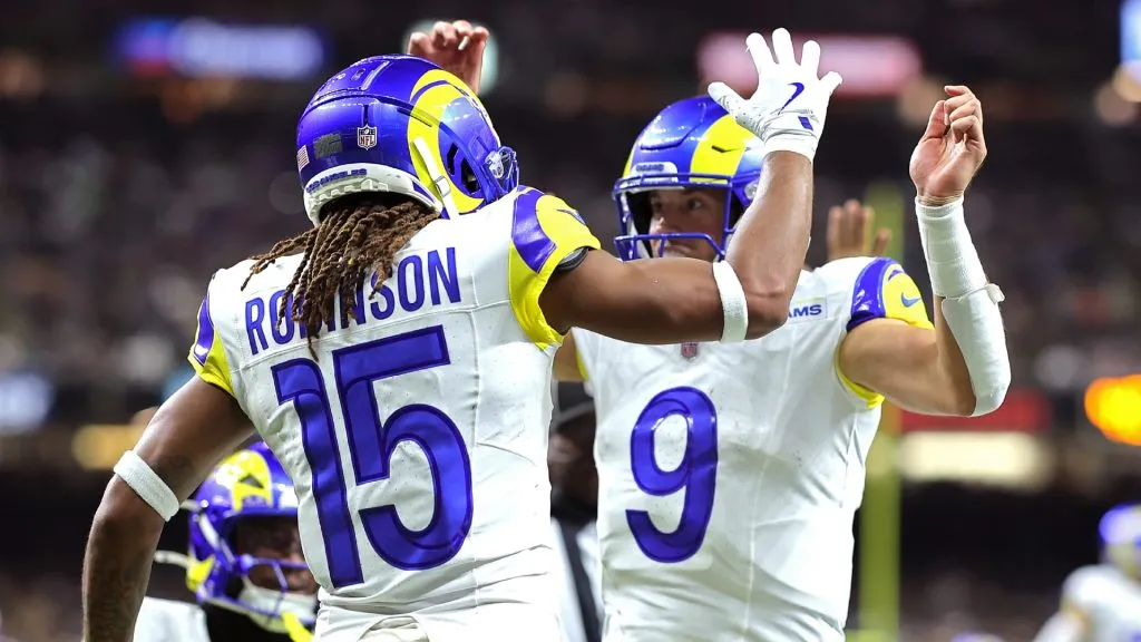 Matthew Stafford #9 and Demarcus Robinson #15 of the Los Angeles Rams celebrate after a touchdown against the New Orleans Saints during the fourth quarter at Caesars Superdome on December 01, 2024 in New Orleans, Louisiana.