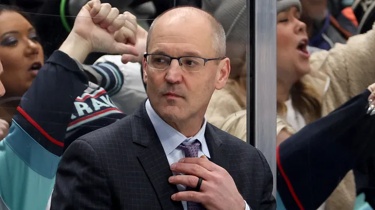 Head coach Dan Bylsma of the Seattle Kraken looks on as fans react after three goals against in the first period against the Calgary Flames at Climate Pledge Arena on February 02, 2025 in Seattle, Washington.