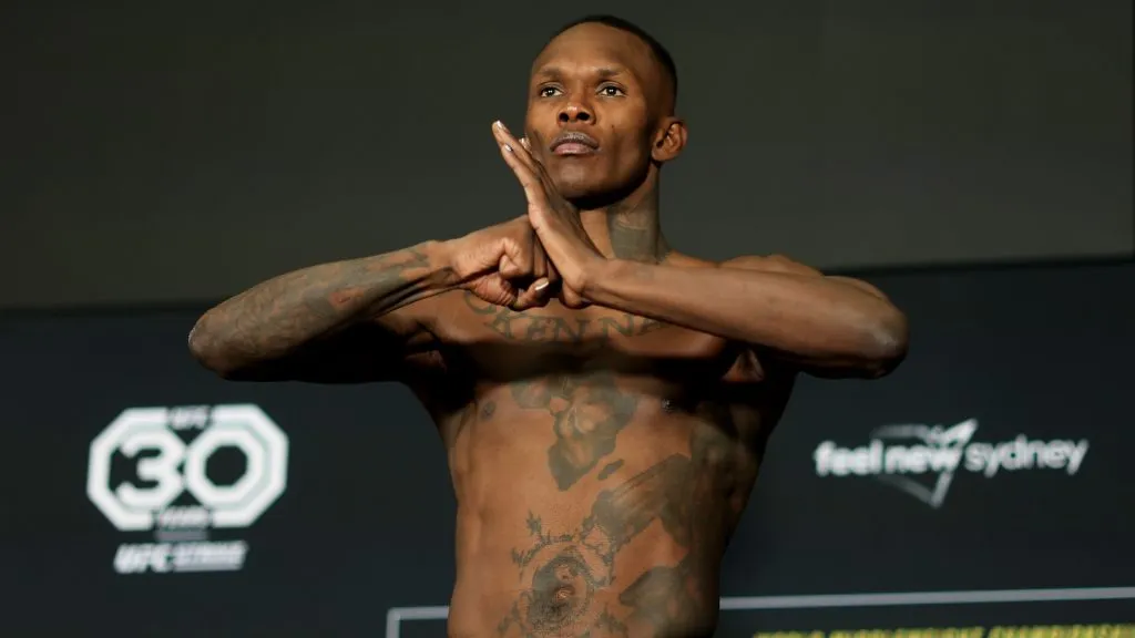 Israel Adesanya of Nigeria poses on the scale during the weigh in for UFC 293 at the Hilton on September 08, 2023. (Source: Mark Evans/Getty Images)