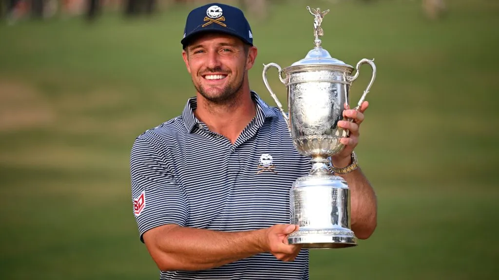 Bryson DeChambeau of the United States poses with the trophy after winning the 124th U.S. Open at Pinehurst Resort on June 16, 2024. (Source: Ross Kinnaird/Getty Images)