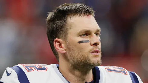 Tom Brady #12 of the New England Patriots reacts after the Los Angeles Rams intercept the ball in the first half during Super Bowl LIII at Mercedes-Benz Stadium on February 3, 2019 in Atlanta, Georgia.
