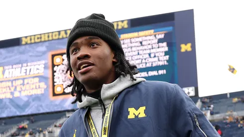 Michigan commitment Bryce Underwood on the field with his girlfriend prior to the Michigan Wolverines playing the Northwestern Wildcats at Michigan Stadium on November 23, 2024 in Ann Arbor, Michigan.