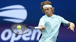 Andrey Rublev of Russia returns a shot against Grigor Dimitrov of Bulgaria during the 2024 US Open.