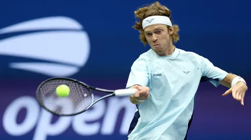 Andrey Rublev of Russia returns a shot against Grigor Dimitrov of Bulgaria during the 2024 US Open.