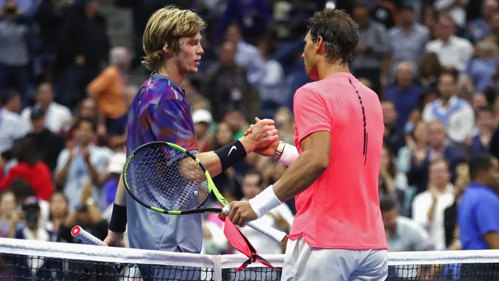 Andrey Rublev of Russia shakes hands with Rafael Nadal of Spain after Nadal won their Men’s Singles Quarterfinal match of the 2017 US Open. (Clive Brunskill/Getty Images)