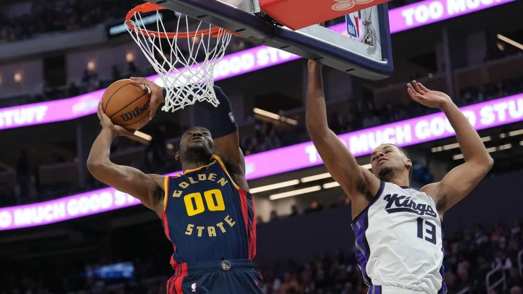 Jonathan Kuminga #00 of the Golden State Warriors goes up for a slam dunk over Keegan Murray #13 of the Sacramento Kings. (Thearon W. Henderson/Getty Images)