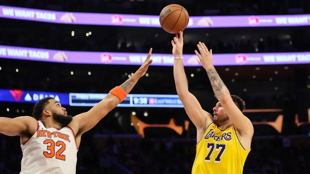 Luka Doncic #77 of the Los Angeles Lakers shoots the ball defended by Karl-Anthony Towns #32 of the New York Knicks in the second half at Crypto.com Arena. (Meg Oliphant/Getty Images)