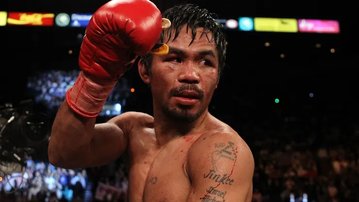 Filipino icon Manny Pacquiao celebrates his 12 round TKO victory against Miguel Cotto during their WBO welterweight title fight at the MGM Grand Garden Arena on November 14, 2009.