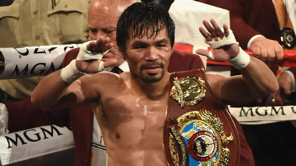 Manny Pacquiao celebrates as he leaves the ring after defeating Timothy Bradley Jr. by unanimous decision in their welterweight fight on April 9, 2016. (Source: Ethan Miller/Getty Images)