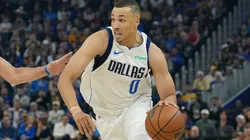 Dante Exum #0 of the Dallas Mavericks dribbles the ball to the basket on Stephen Curry #30 of the Golden State Warriors during the first half at Chase Center on February 23, 2025 in San Francisco, California.