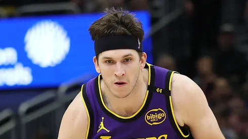 Austin Reaves #15 of the Los Angeles Lakers handles the ball during a game against the Milwaukee Bucks