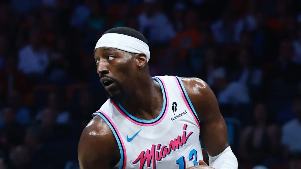 Bam Adebayo #13 of the Miami Heat controls the ball against the Boston Celtics