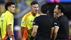 Luis Diaz (L) and James Rodriguez of Colombia argue with referees during the CONMEBOL Copa America 2024 semifinal match between Uruguay and Colombia at Bank of America Stadium on July 10, 2024 in Charlotte, North Carolina.