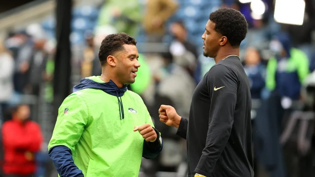Russell Wilson #3 of the Seattle Seahawks speaks with Jameis Winston #2 of the New Orleans Saints prior to a game at Lumen Field on October 25, 2021 in Seattle, Washington.
