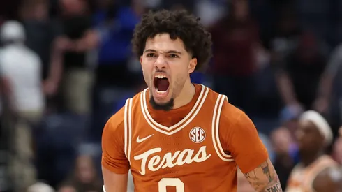Jordan Pope #0 of the Texas Longhorns celebrates after the 94-89 2OT win over the Texas A&M Aggies during the SEC Men's Basketball Tournament – First Round at Bridgestone Arena on March 12, 2025 in Nashville, Tennessee.