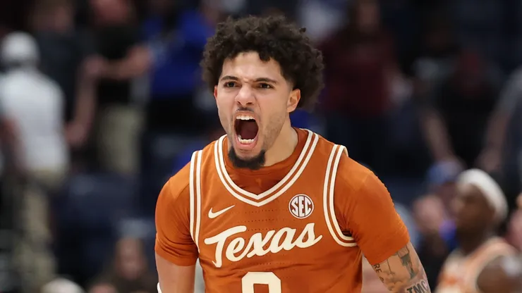 Jordan Pope #0 of the Texas Longhorns celebrates after the 94-89 2OT win over the Texas A&M Aggies during the SEC Men's Basketball Tournament - First Round at Bridgestone Arena on March 12, 2025 in Nashville, Tennessee.