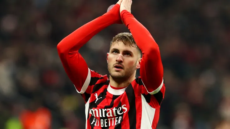 Santiago Gimenez of AC Milan celebrates scoring his team's first goal during the UEFA Champions League 2024/25 League Knockout Play-off second leg match between AC Milan and Feyenoord in 2025.