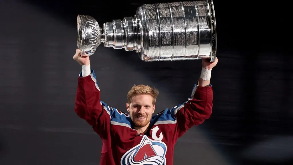 Gabriel Landeskog #92 of the Colorado Avalanche skates with the Stanley Cup at a ceremony celebrating their NHL Championship before their home opener against the Chicago Blackhawks at Ball Arena on October 12, 2022 in Denver, Colorado.