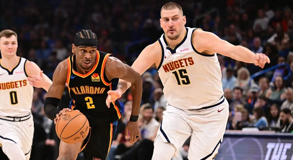 Shai and Nikola Jokic playing at the Paycom Center.